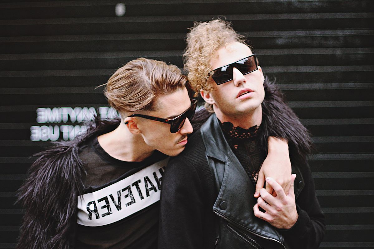 man putting his right hand on man's shoulder