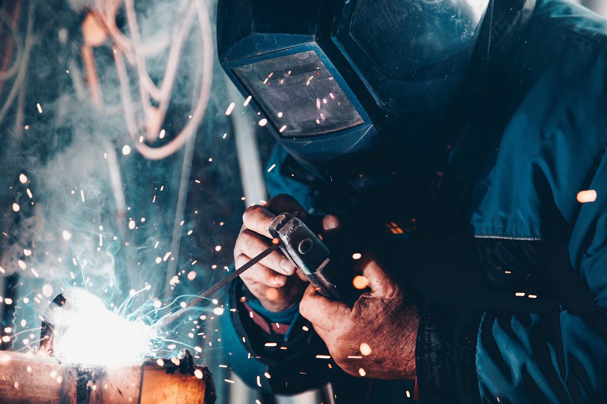 man using welding machine