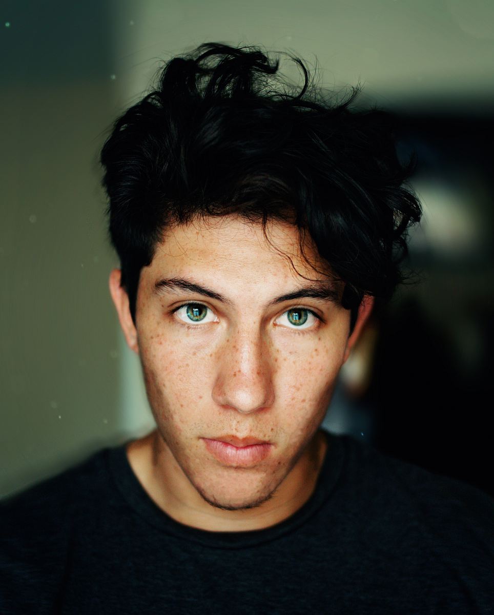 man wearing black crew-neck shirt