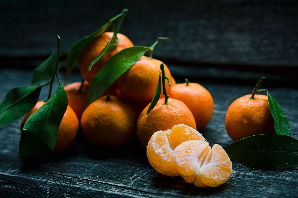 oranges on top of gray wooden table