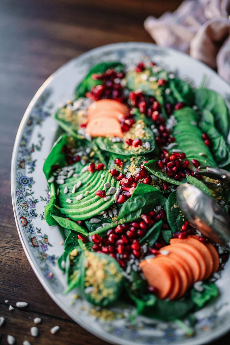 oval ceramic plate with and green and orange food