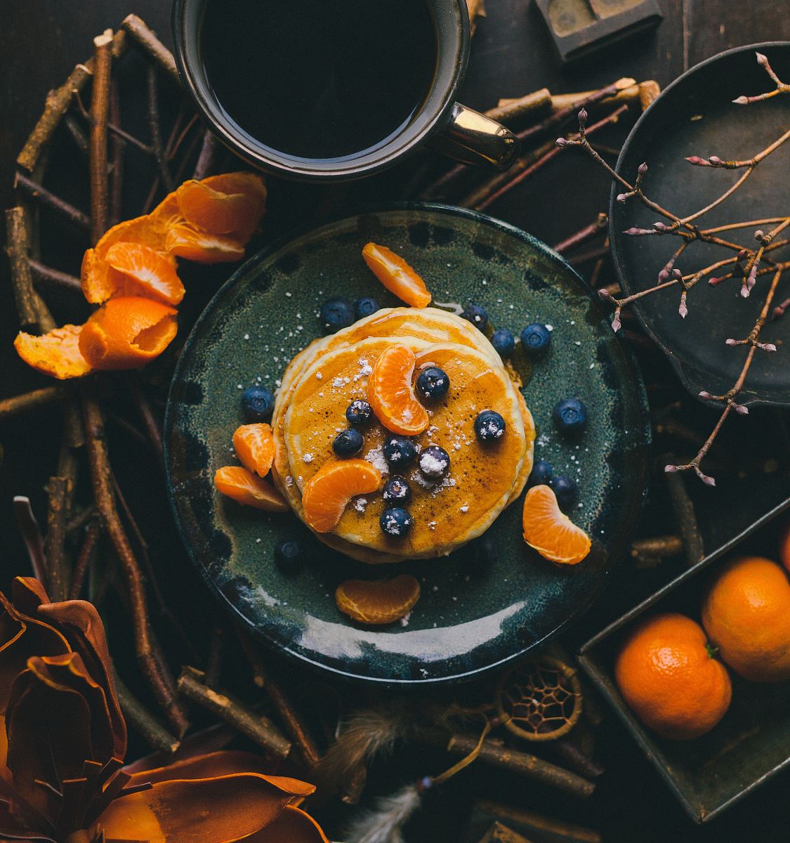 pancakes with orange and blueberry on plate