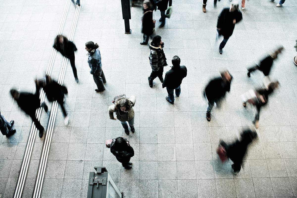 people walking on grey concrete floor during daytime