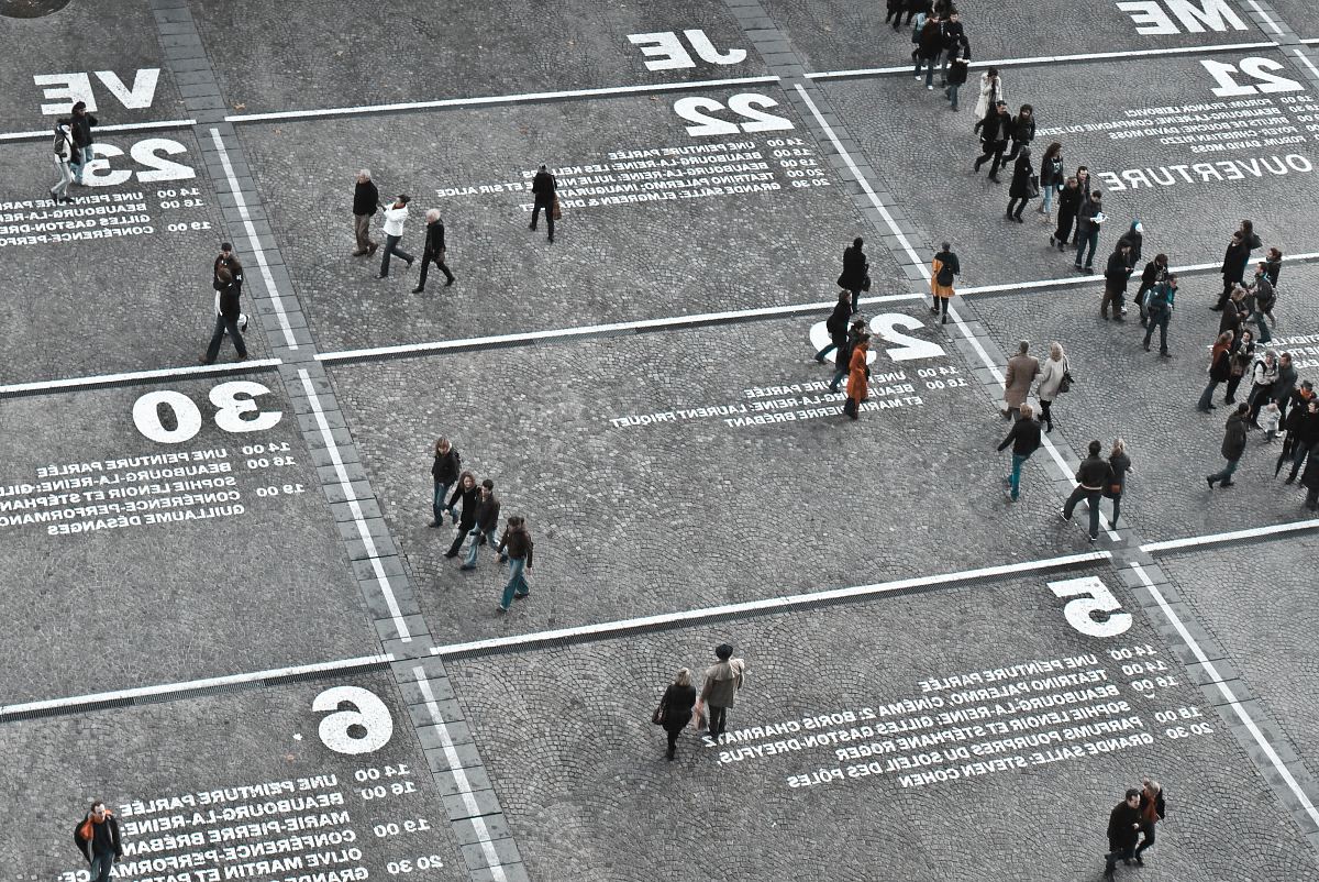 people walking on the road during day time