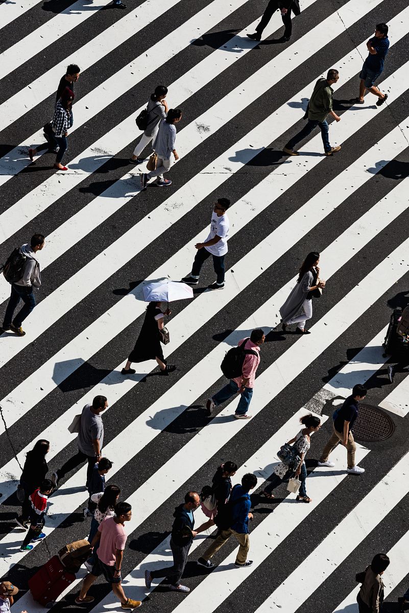 peoples walking on pedestrian lane