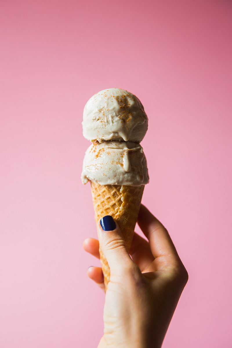 person holding ice cream on cone