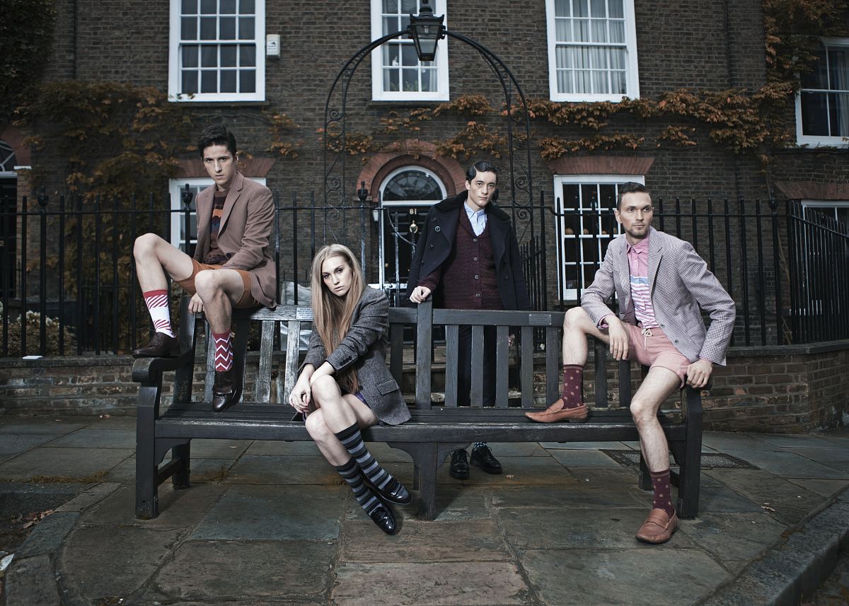 photography of group of people sitting on bench
