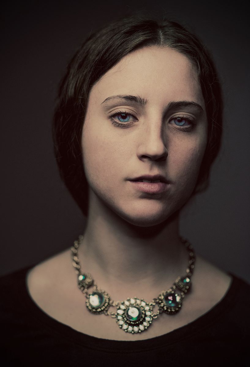 portrait photography of woman in black top