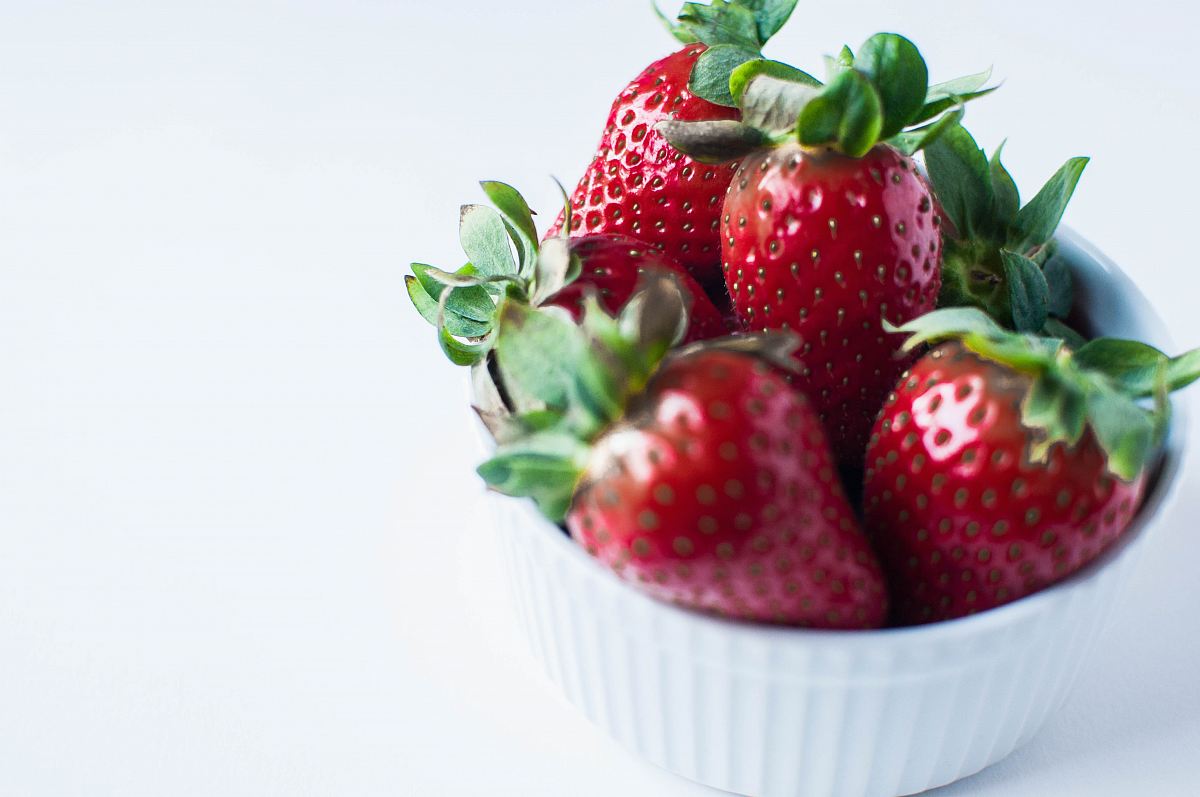 red strawberries in white ramekin