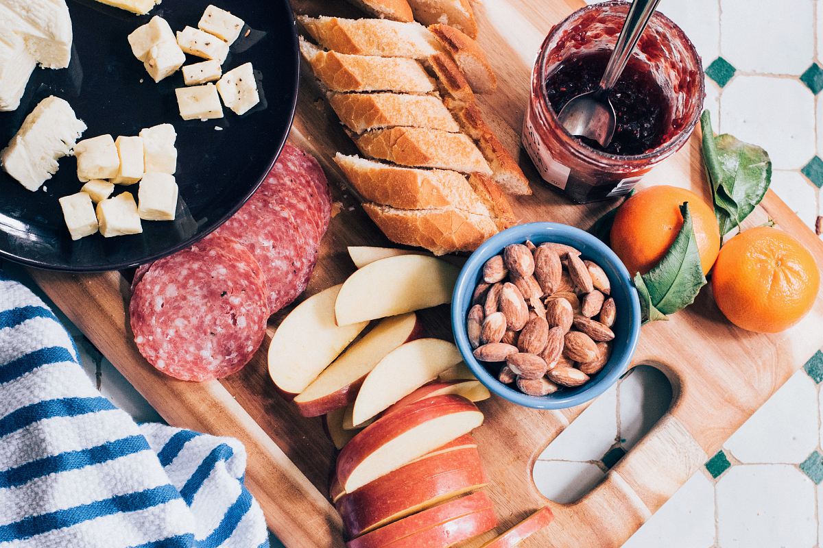 slide of apple and sausage on top of chopping board