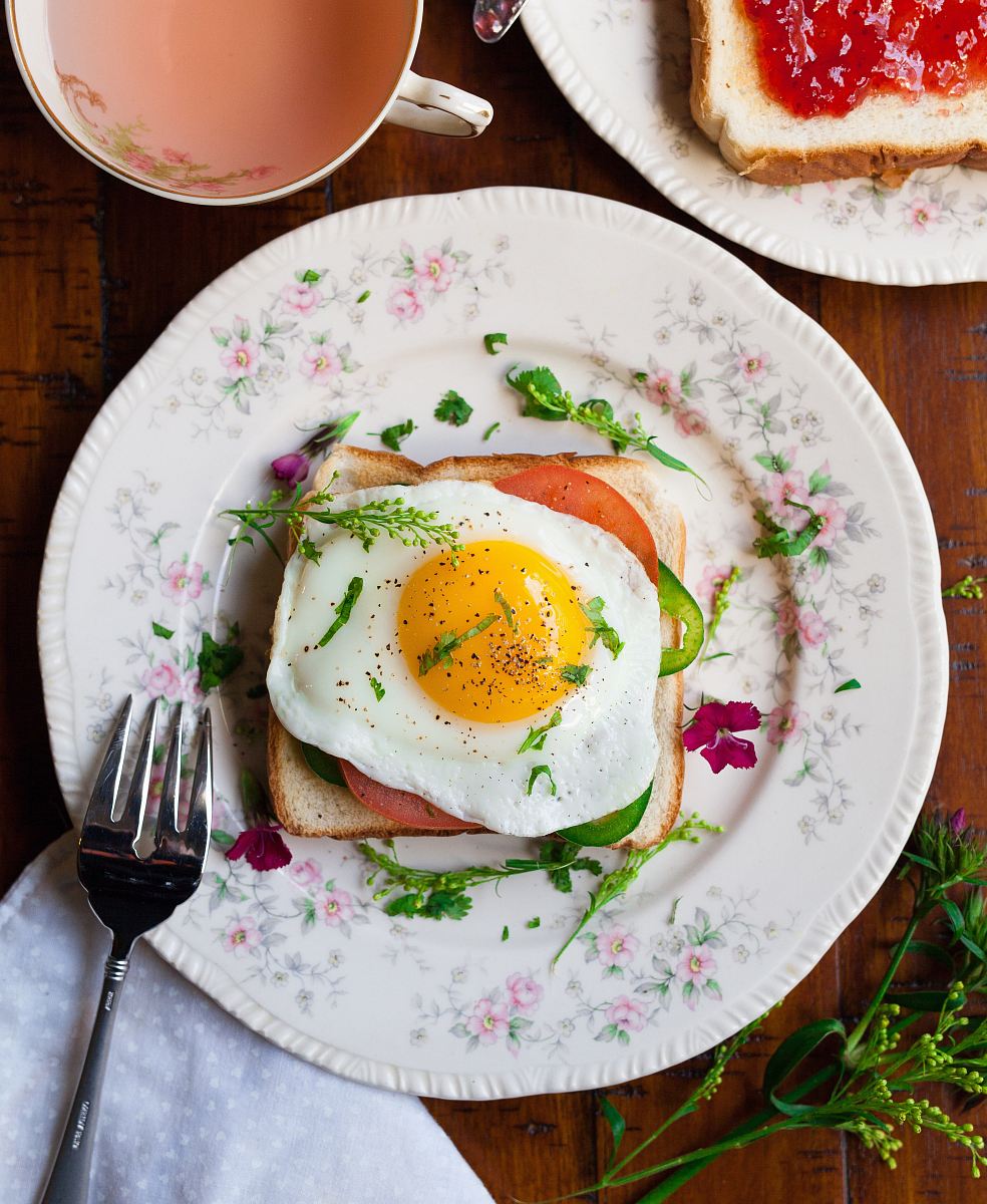 sunny-side up egg with bread beside fork