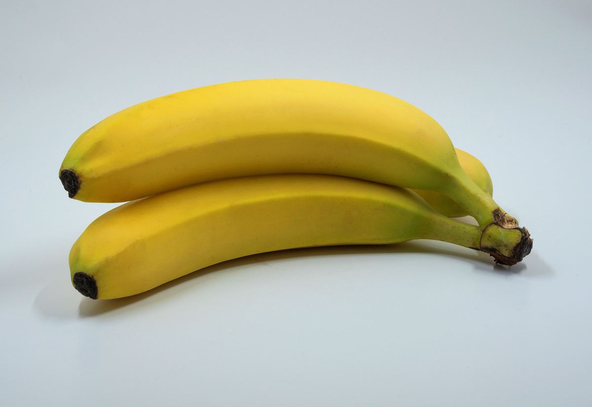 three banana fruits on white background