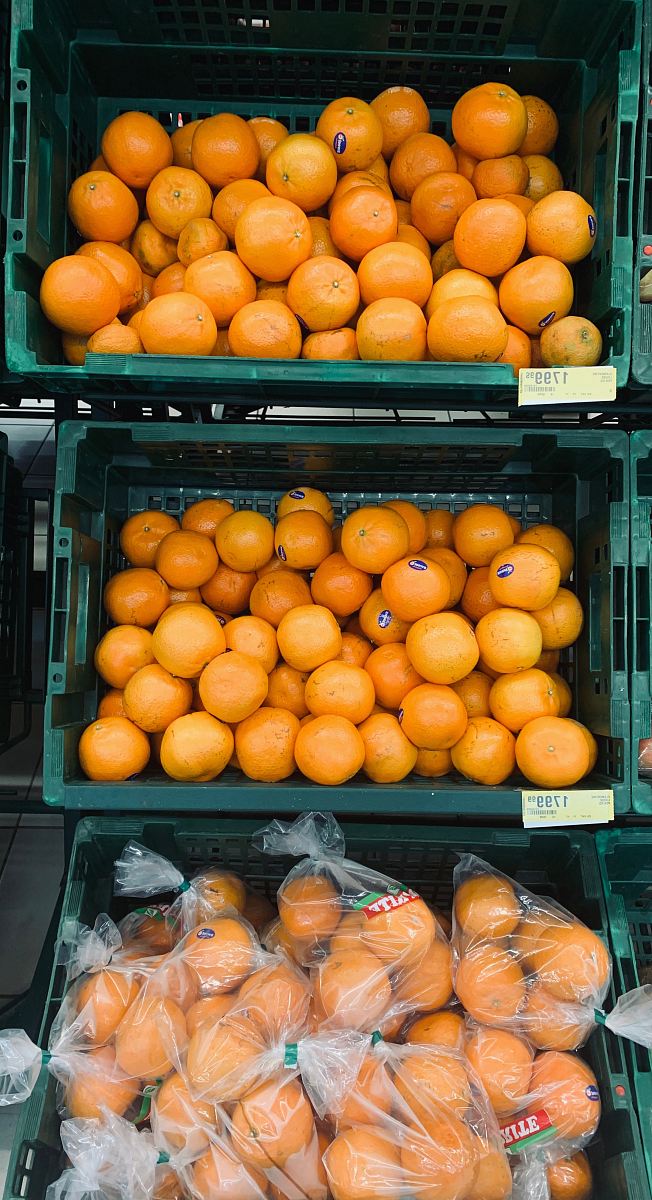 three baskets of oranges