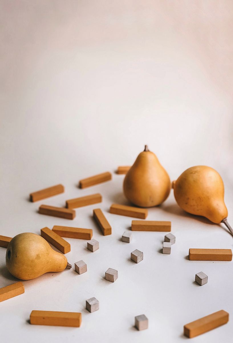 three brown gourds on white surface