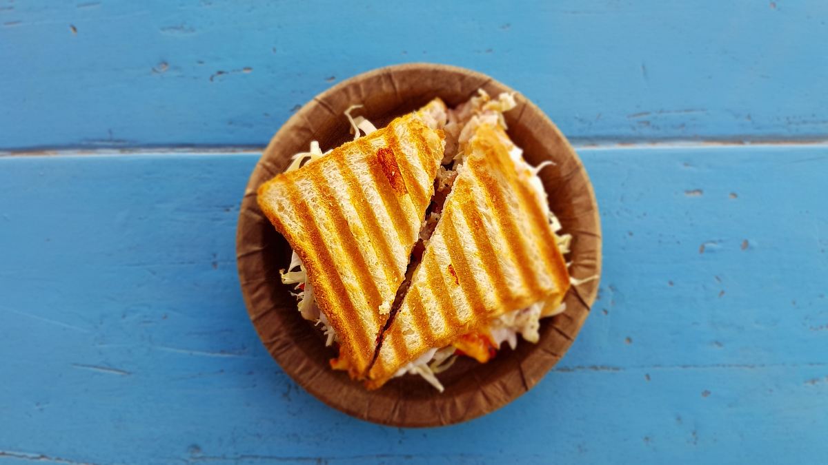 two slices of sandwich on brown container