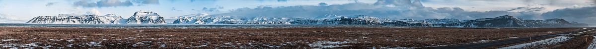 vast field with mountain ranges