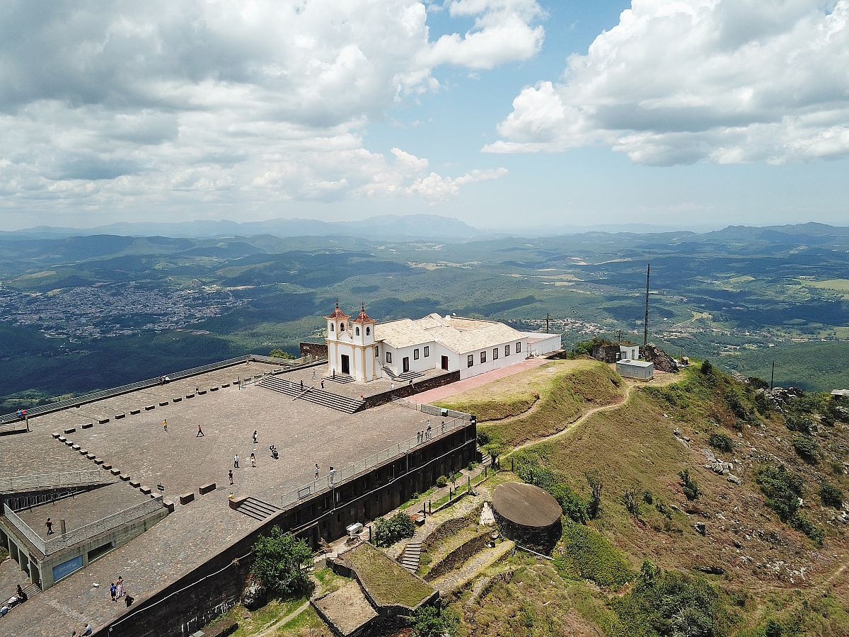 white concrete building on peak at daytime