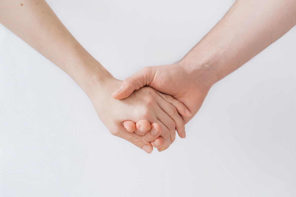 woman and man holding hands
