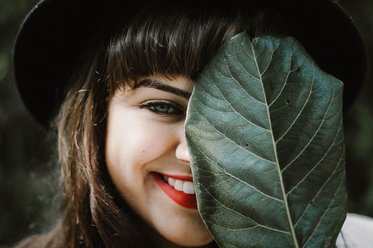 woman holding leaf