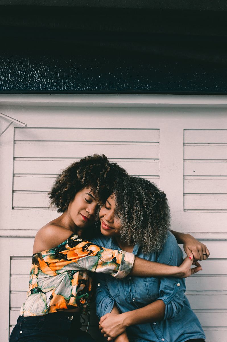 woman hug each other