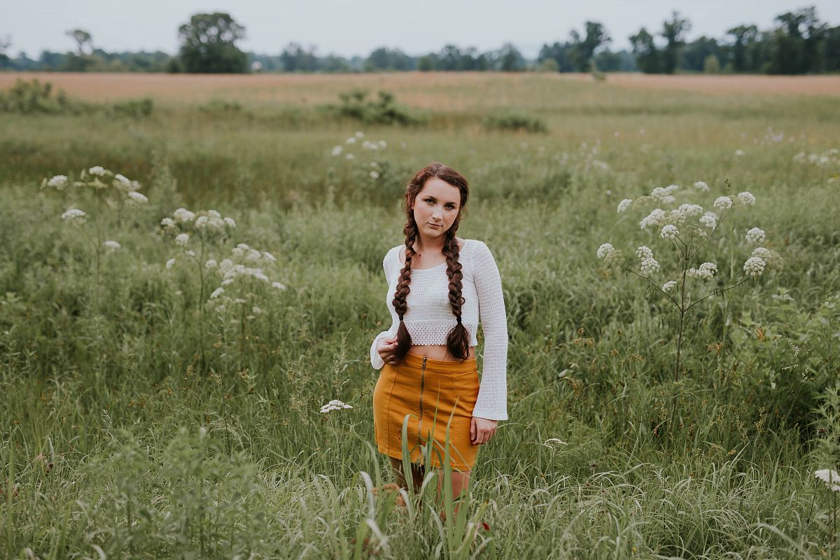 woman standing on green grass field