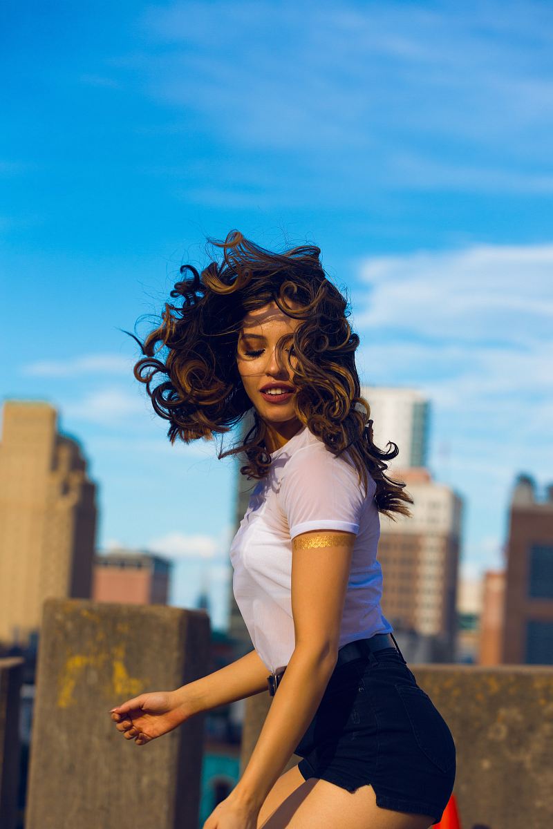 woman wearing white shirt standing