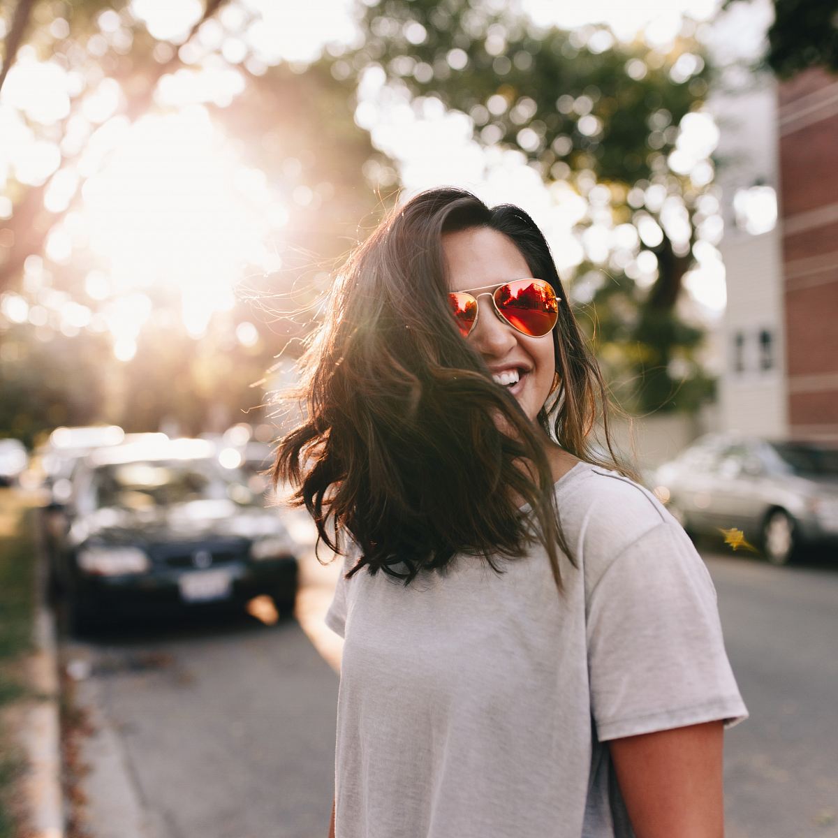 woman wearing white T-shirt smiling