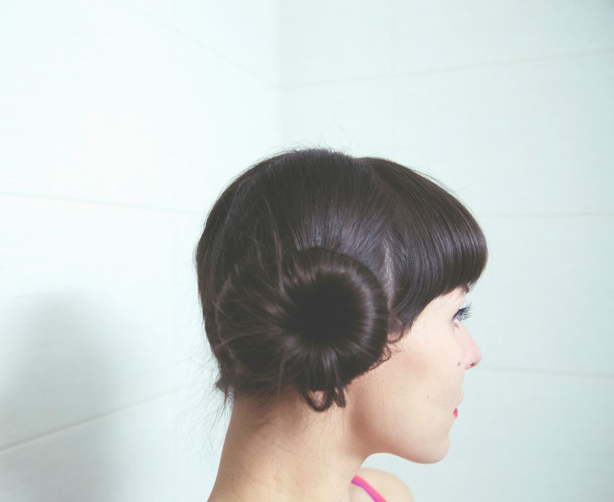 woman with straight black hair bun