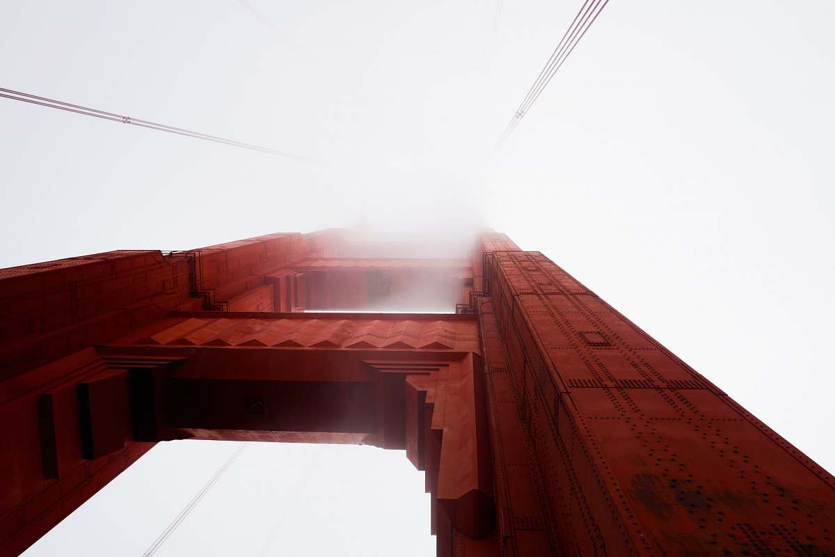 fog worm eye view photography of brown building golden gate bridge