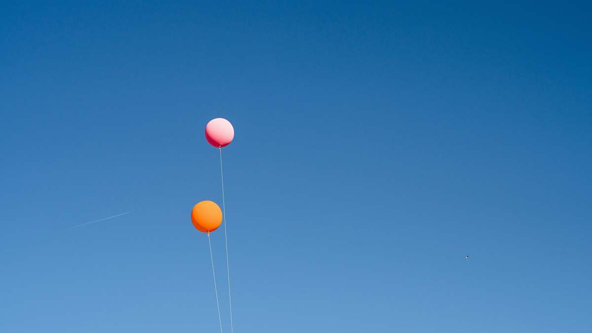 balloon two orange and pink balloons string