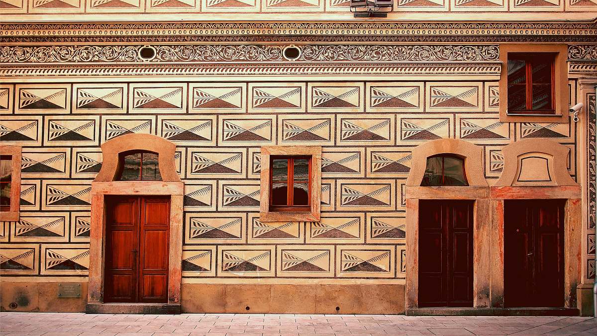 door brown and red concrete building prague