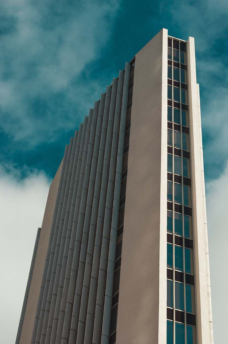 architecture low angle photography of multi-story high rise building during daytime city