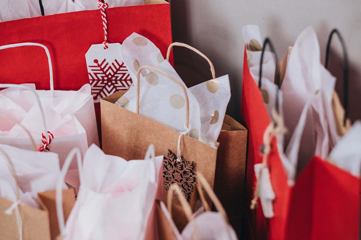 holiday shallow focus photography of paper bags gift