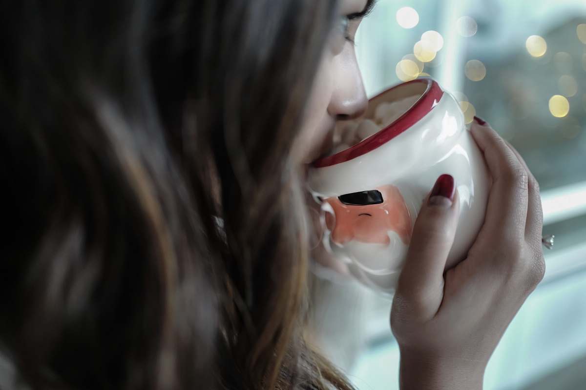 mug woman drinking on white and red ceramic mug hand