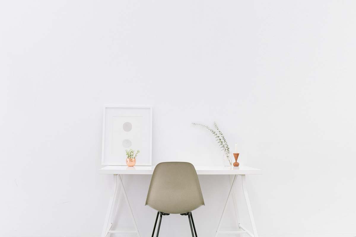 white white wooden table near brown chair office