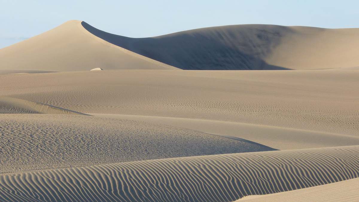 sand landscape photography of desert dune