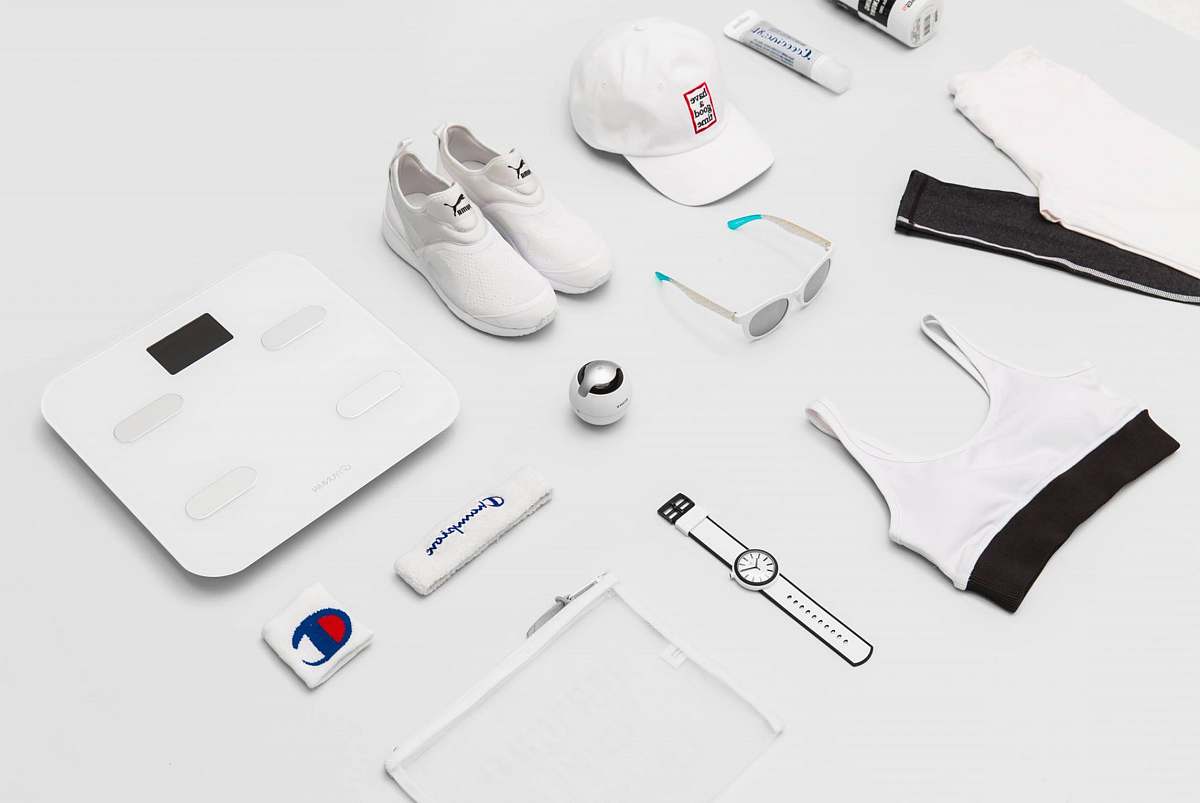 cap flat lay photography of shoes, sunglasses, cap, pants, and sport brassiere clothing