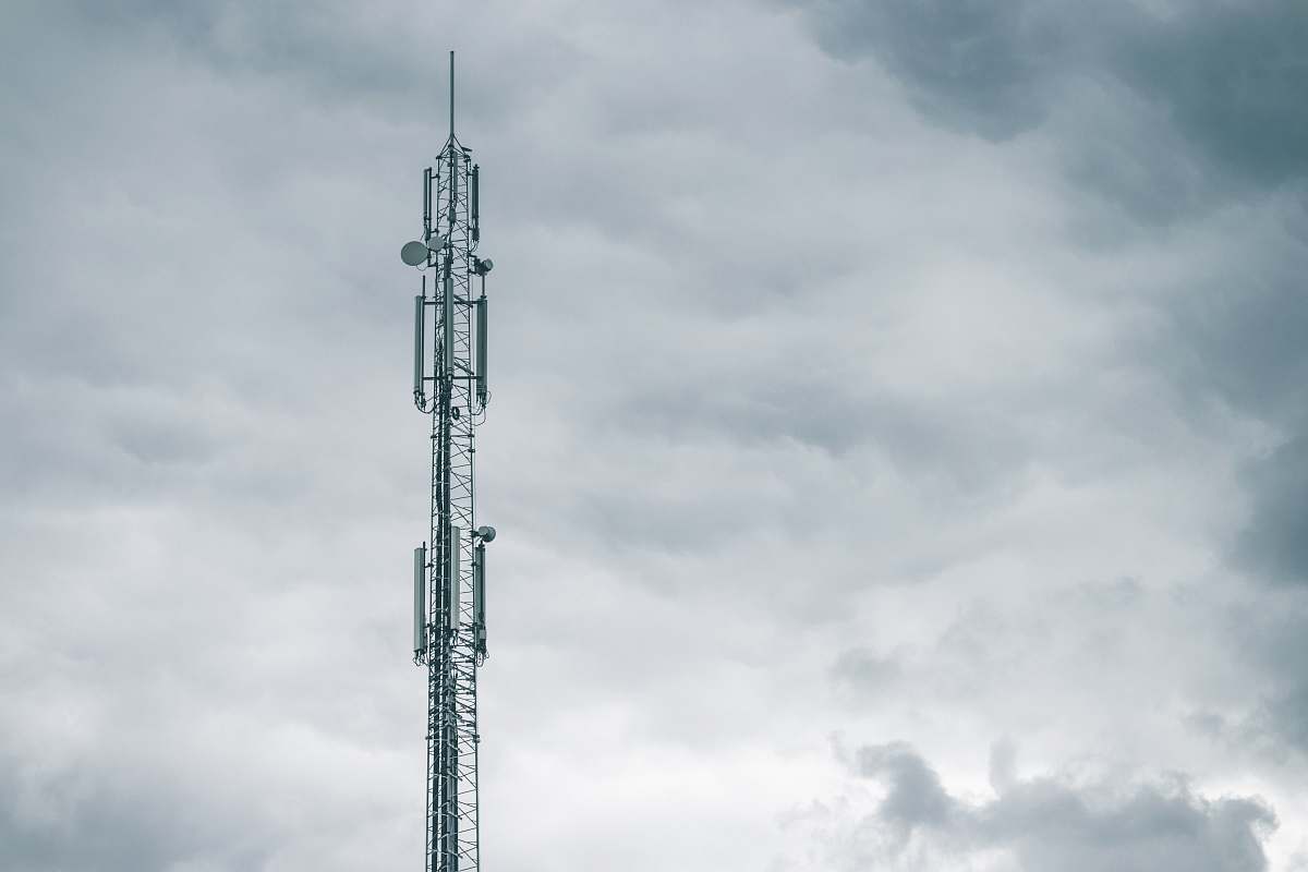 tower gray radio tower under the cloudy sky during daytime electrical device