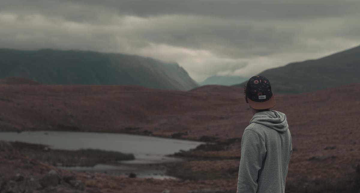 person photo of man wearing gray hoodie and black cap human