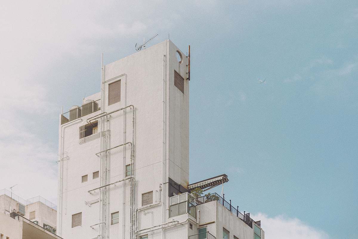 building white concrete high rise building high rise