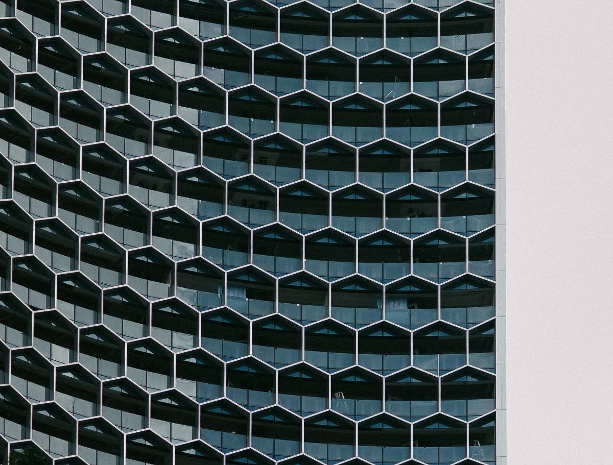 architecture A building with glass hexagon shaped windows pattern
