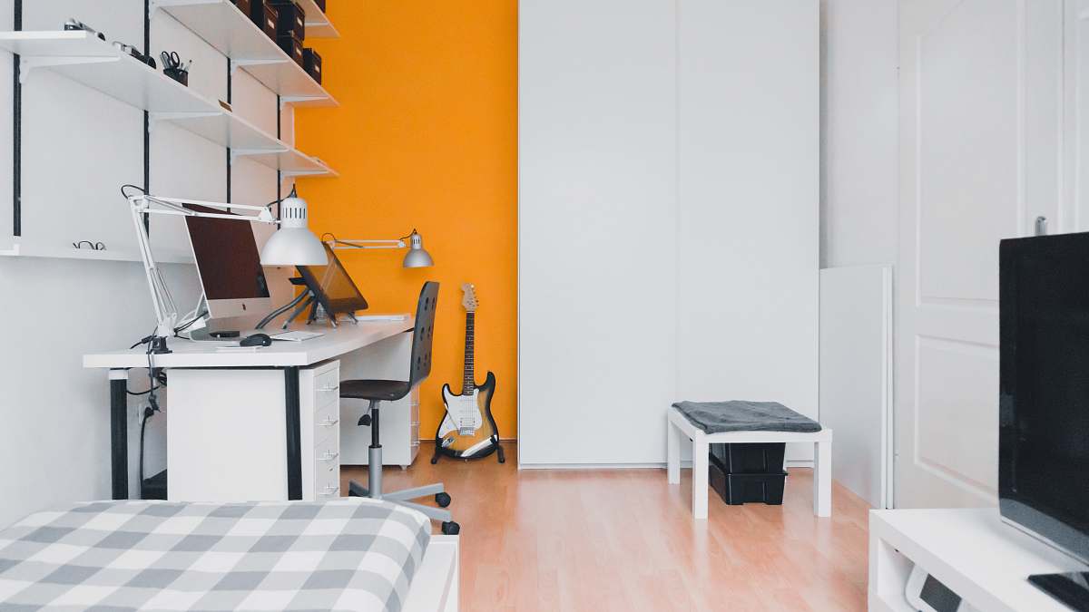 apartment silver iMac turned off on white wooden desk room