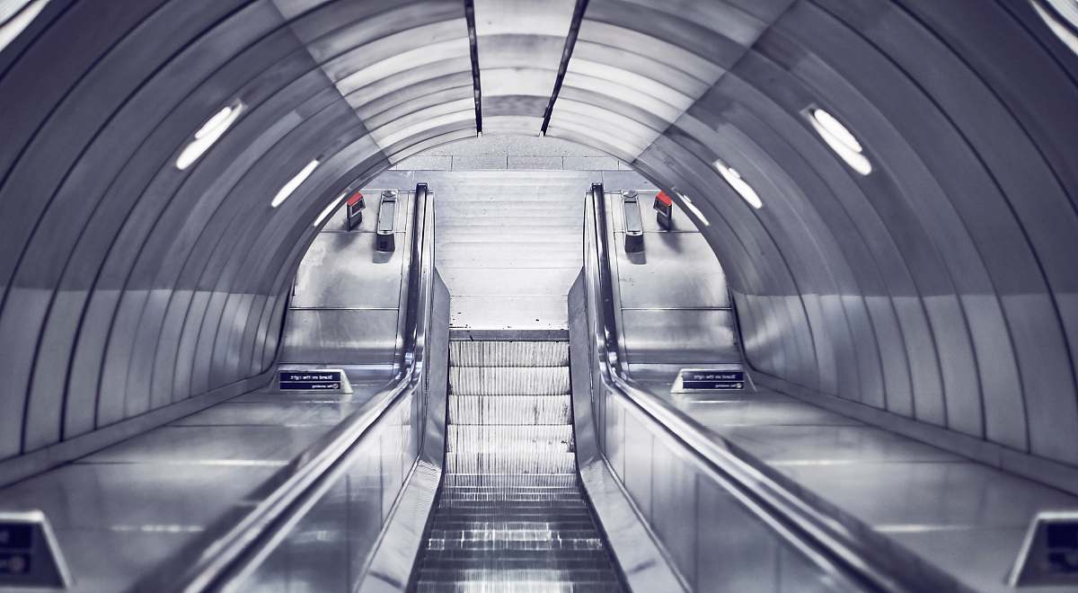 tunnel gray escalator stairs