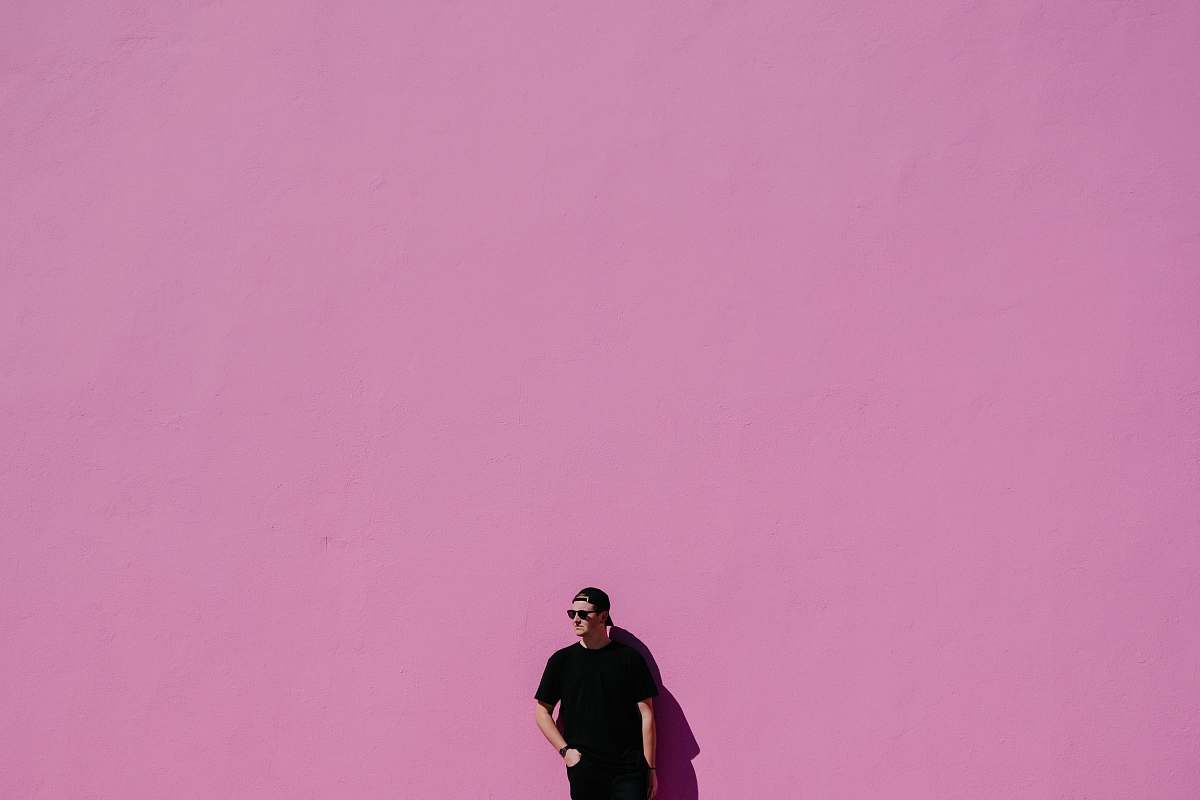 human man in black shirt on pink background people