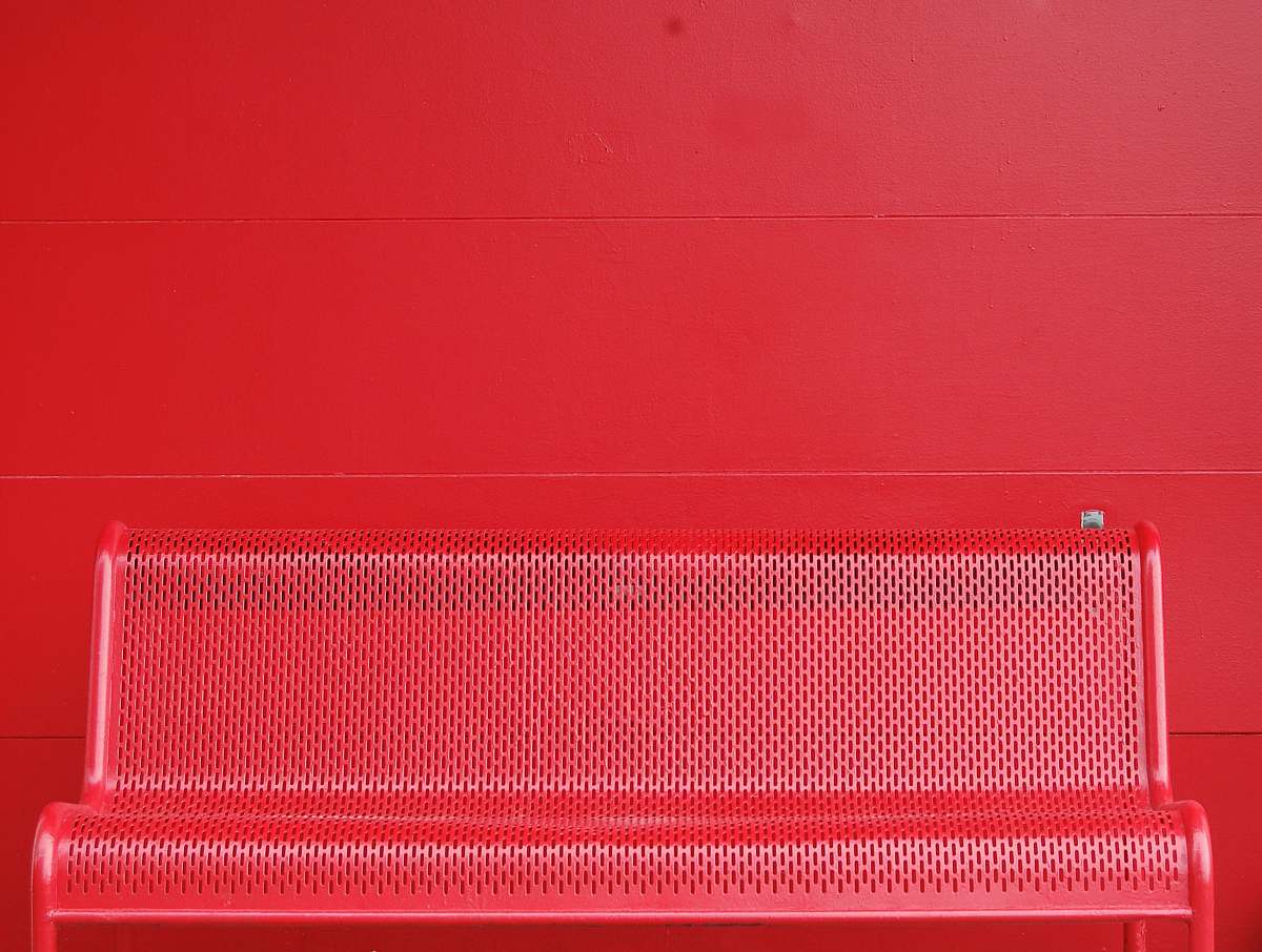 background red metal bench wall