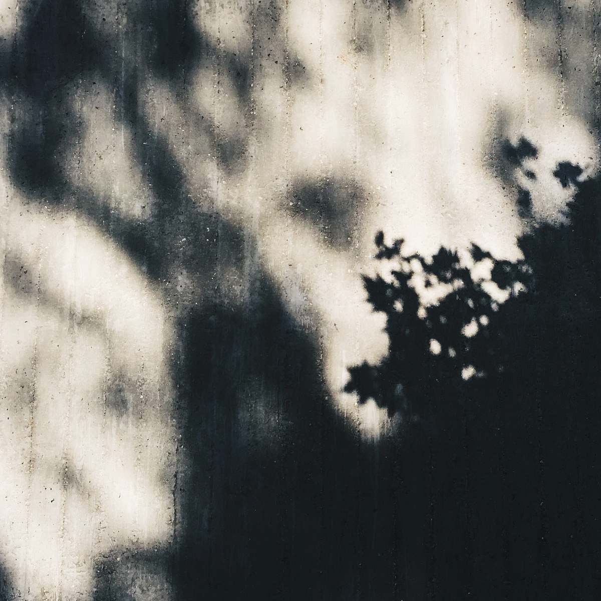 grey shallow focus photography of mirror with raindrops shadows
