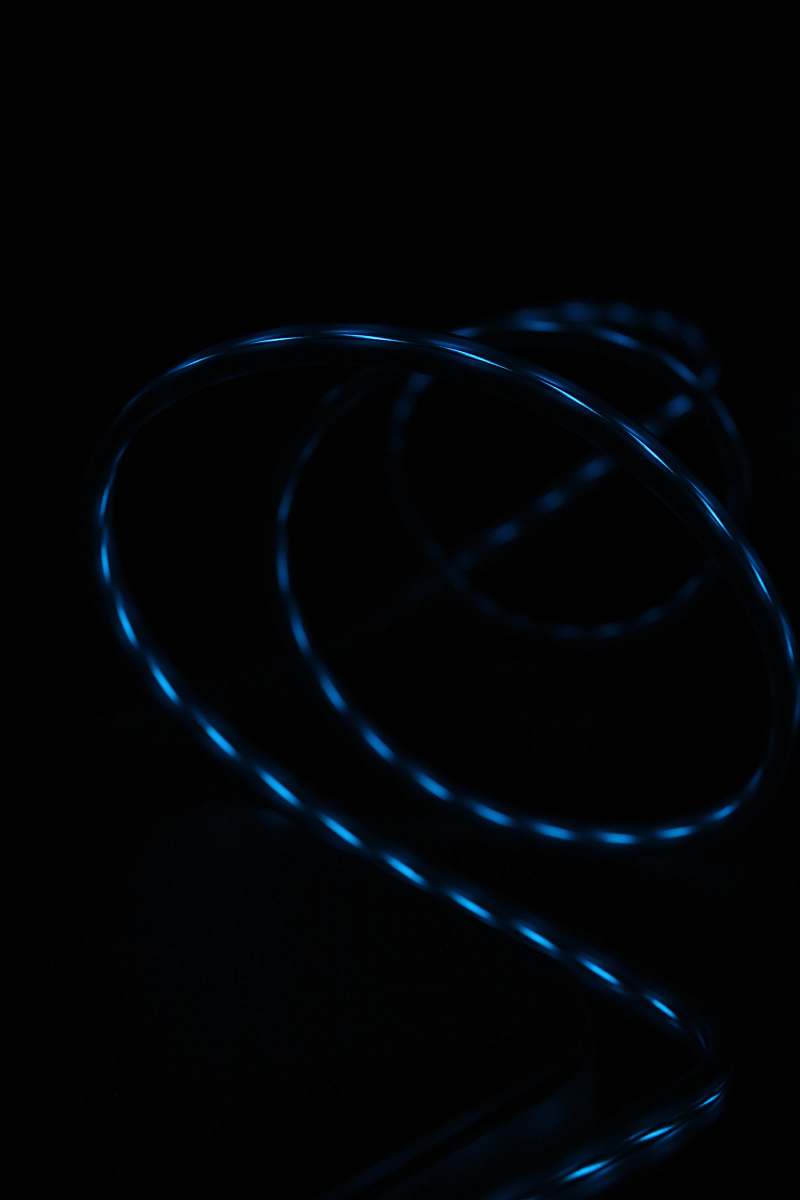 minimalist blue strip light turned on in dark room wallpaper
