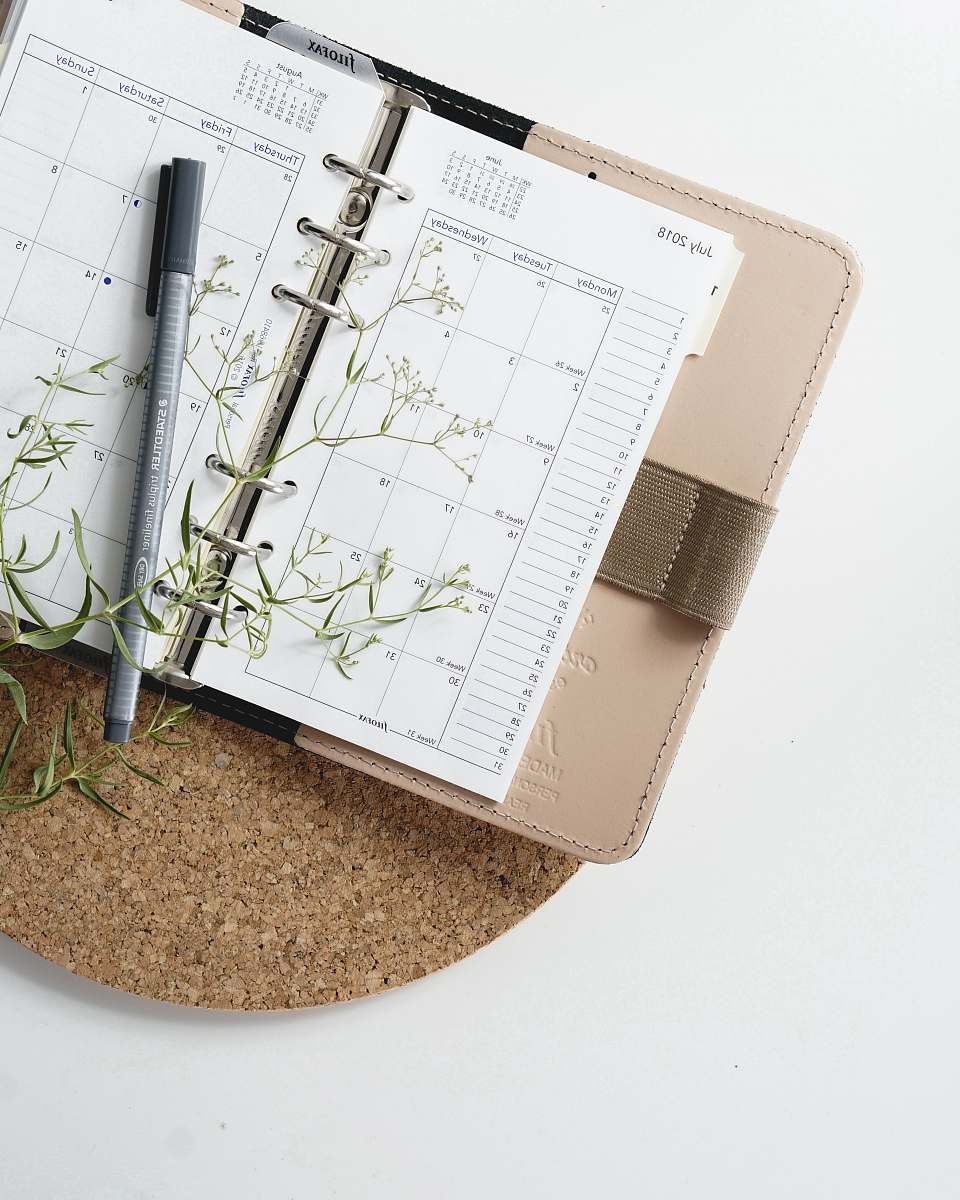 romania grey and black pen on calendar book schedule