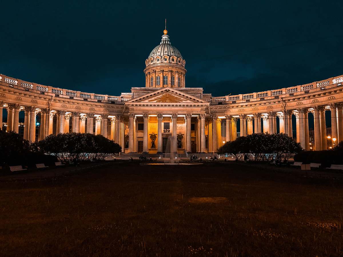 dome white concrete structure during nighttime metropolis