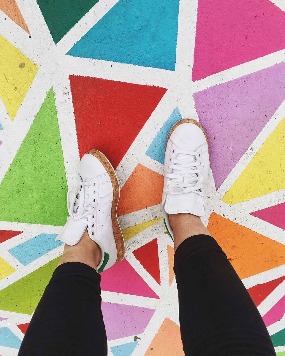 color person wearing white adidas Stand Smith sneankers colours